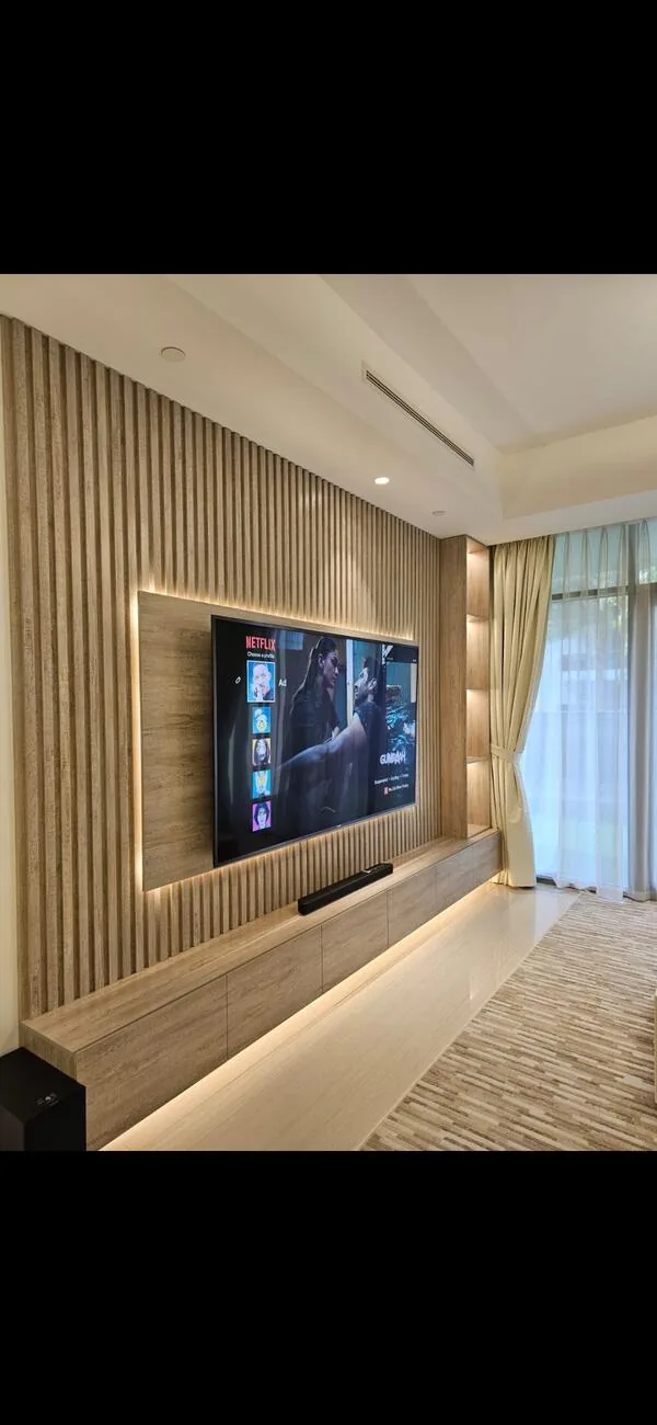 Backlit slat feature wall — Dubai apartment interior fit-out